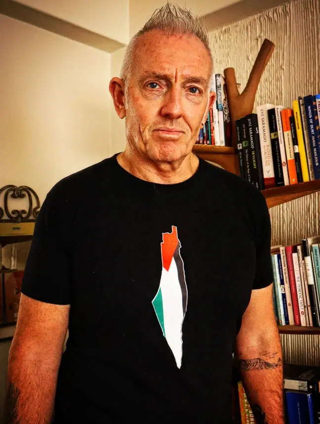 Telford Vice, portrait against a bookshelf