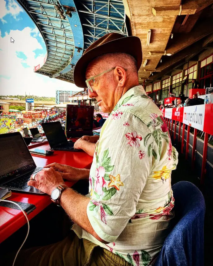 Telford Vice at work on a laptop in a cricket ground press box